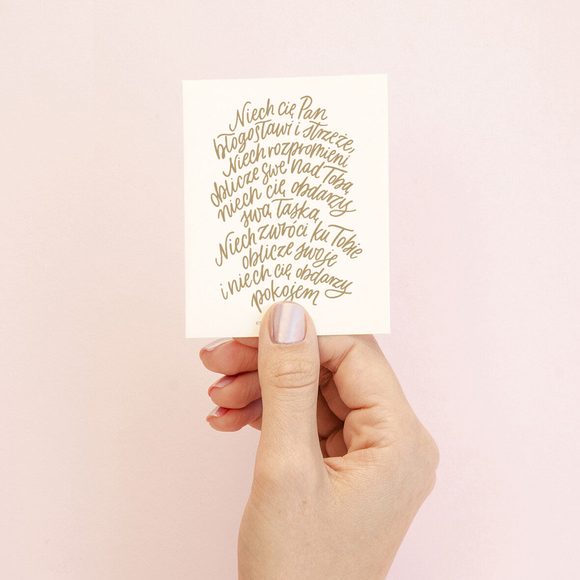 Vertical top view love romantic letter mockup Valentine with copy space for a letter. The white square card on female hand on a pink background Vertical top view love romantic letter mockup Valentine with copy space for a letter. The white square card on female hand on a pink background